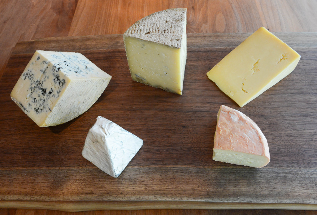 Angela Jenkins chose five cheeses that are her "must try cheeses". From left going clockwise: Pt. Reyes Bay Blue from California, TED Kenny's Farm House from Kentucky, Keen's English Cheddar, Oma from Jasper Hill Vermont and Baetje Farms' Bloomsdale. All are of course available at Artisan Cheese Company. Photo by Rachel O'Hara