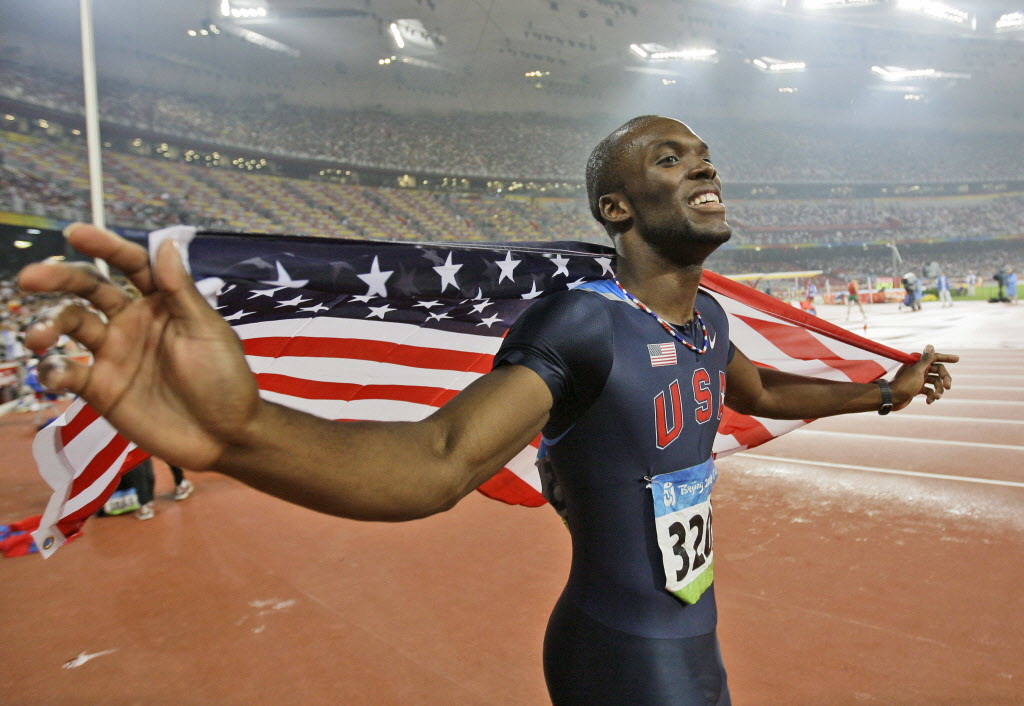 United States' LaShawn Merritt celebrates winning the gold in the men's 400-meter race during the athletics competitions in the National Stadium  at the Beijing 2008 Olympics in Beijing, Thursday, Aug. 21, 2008. (AP Photo/David J. Phillip)