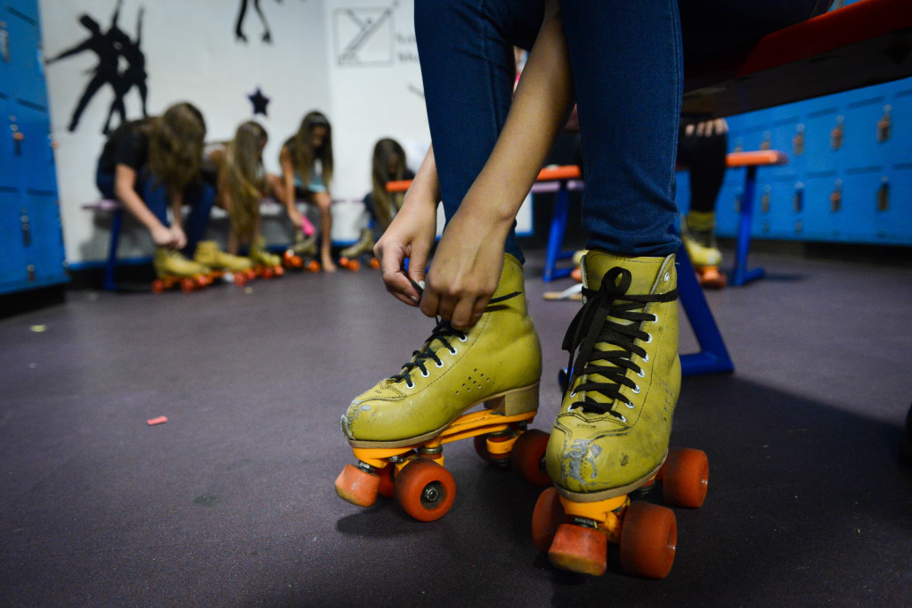 Hayley Decker, 11, laces up her rental skates at Stardust Skate Center.  Photo by Rachel S. O'Hara