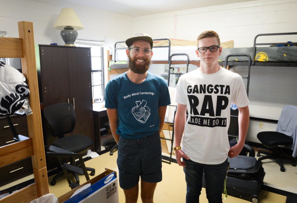 David Kujawski and Robert Goethe stand inside the Ringling dorm they share with a third roommate. Photo by Rachel O'Hara.