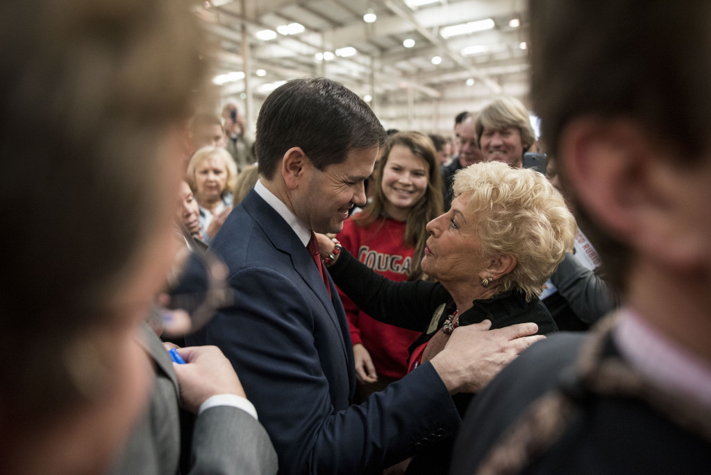 Toni Parsons of Bradenton embraces Presidential Candidate Marco Rubio after a town hall session at Marine Concepts on Monday, January 11, 2016.   STAFF PHOTO / NICK ADAMS