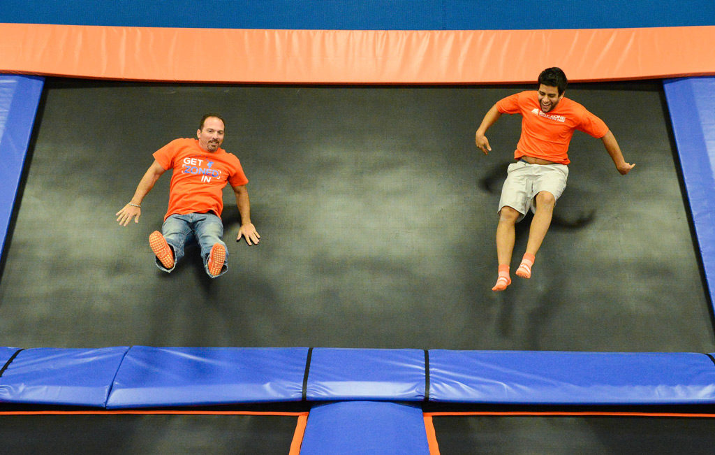 Owner Paul Orsino and assistant manager Adam Orsini jump around inside the new Sky Zone Indoor Trampoline Park. Photo by Rachel S. O'Hara.