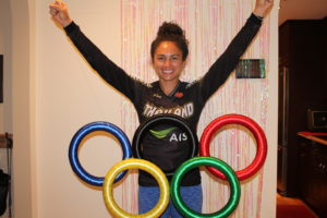 Carr celebrates making the Thailand Olympic team and poses for a photo in front of the Olympic rings. Photo provided by Amanda Carr. 