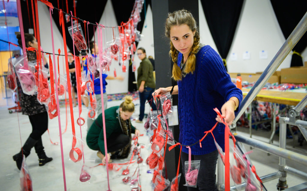 Ana Juarez, a student of FSU's Museum and Cultural Heritage Studies program, works on getting ribbons ready to hang for Anne Patterson's "Pathless Woods" exhibit. Herald-Tribune staff photo / Rachel S. O'Hara