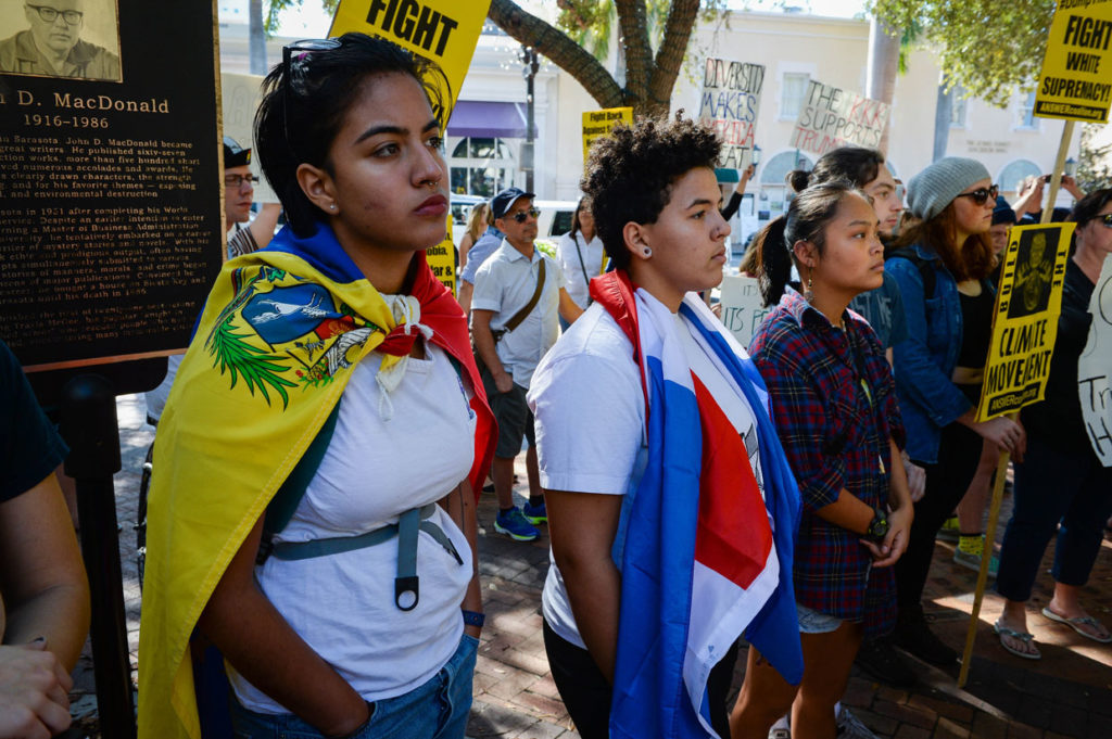 Diana Barroeta and Lorraine Cruz wore flags from Venezuela and the Dominican Republican at the protest.